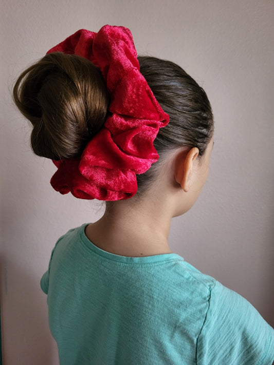 Introducing "Celeste," the epitome of sophistication and style in the form of a scrunchie. Handmade with precision and care, this red velour beauty is designed to elevate your hair game, offering a perfect blend of comfort and elegance.