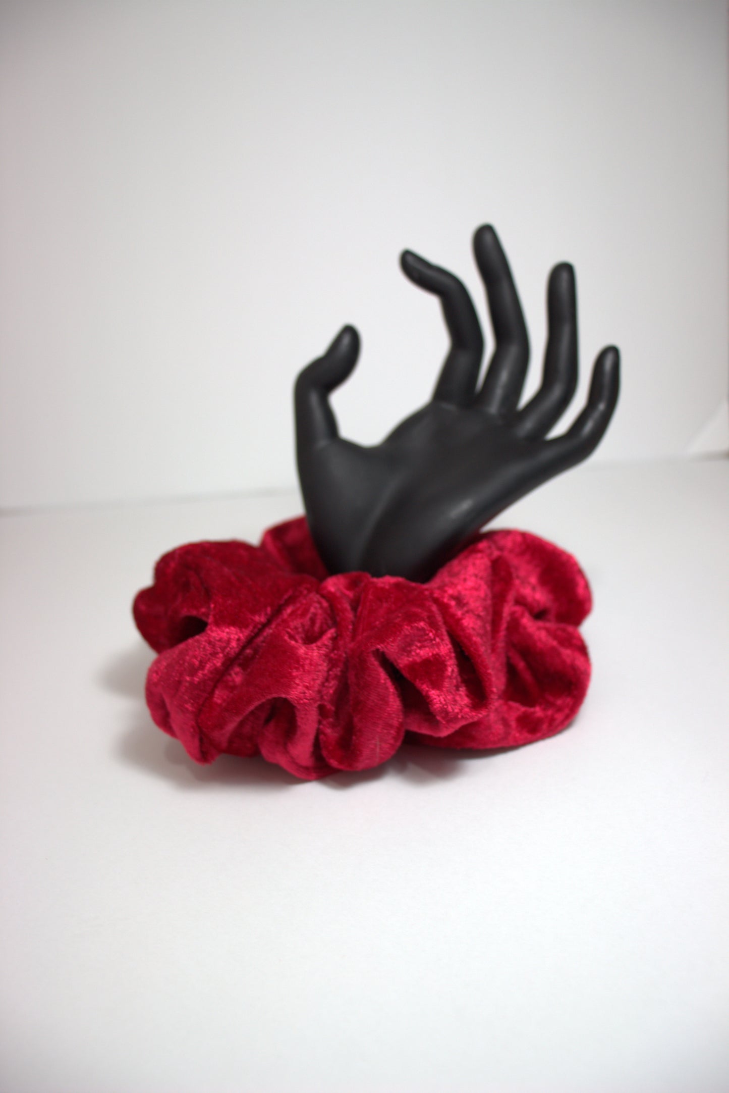 Introducing "Celeste," the epitome of sophistication and style in the form of a scrunchie. Handmade with precision and care, this red velour beauty is designed to elevate your hair game, offering a perfect blend of comfort and elegance.