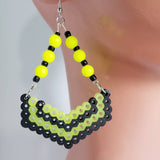 The CyberGlow dangling earrings are fun and stylish cyberpunk-inspired earrings. The earrings are made using Perler beads that glow in the dark when exposed to light. The beads are neon color with black glass e-beads.   Contains: Perler beads Neon beads Glass E-beads Nickel-free fish hook Handmade-Ocala,FL
