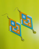 Meet Mina, the beautiful geometric dangling earrings made using Perler beads and glass beads.   Contains: Dangling Earrings Perler Beads Glass Beads   Dimensions: 1.5"x3"