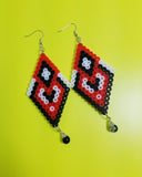 Meet Rei, the beautiful dangling earrings are Native American-inspired made using Perler beads and glass beads.  Contains: Dangling Earrings Red Glass Beads Handmade in Ocala, FL