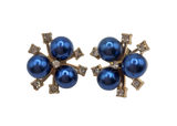 Pair of earrings with blue pearls and gold accents on a white background