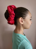 Introducing "Celeste," the epitome of sophistication and style in the form of a scrunchie. Handmade with precision and care, this red velour beauty is designed to elevate your hair game, offering a perfect blend of comfort and elegance.