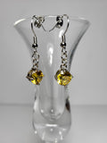 Full Pair: Elegant dangle earrings with yellow rhinestones and intricate silver details.