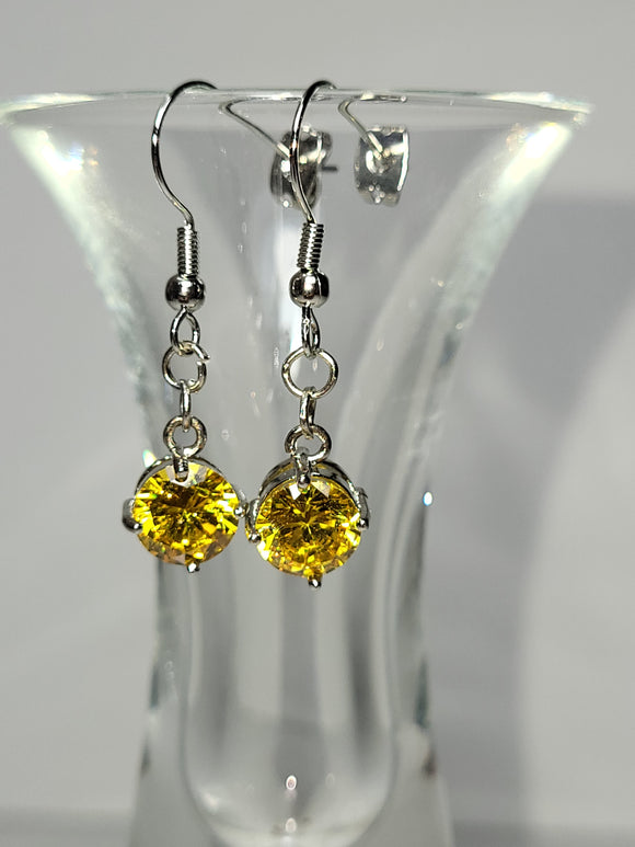 Full Pair: Elegant dangle earrings with yellow rhinestones and intricate silver details.