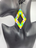 Earrings on Model: The earrings worn by a model, highlighting their size and how they dangle.