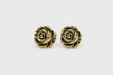 Pair of gold rose-shaped earrings on a white background