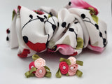 a close up of the Gardenia Fabric Flower with one of our xxl scrunchies
