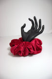 Introducing "Celeste," the epitome of sophistication and style in the form of a scrunchie. Handmade with precision and care, this red velour beauty is designed to elevate your hair game, offering a perfect blend of comfort and elegance.