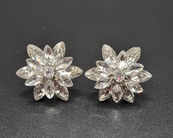 a close up view of Nova Cluster Earrings, these earrings sparkle with Rhinestones