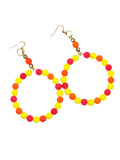 A pair of large hoop earrings made of small round beads in bright yellow, orange, and pink, hanging from gold-tone fishhook wires on a plain white background.