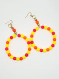 Neon beaded lanyard with gold clasp on a white background