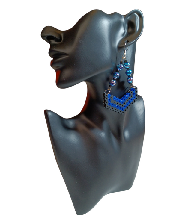 These gorgeous dangle earrings are mixed media using Perler beads and marbled glass beads.      Contains: Perler beads Glass beads Fish Hooks Handmade Ocala,FL